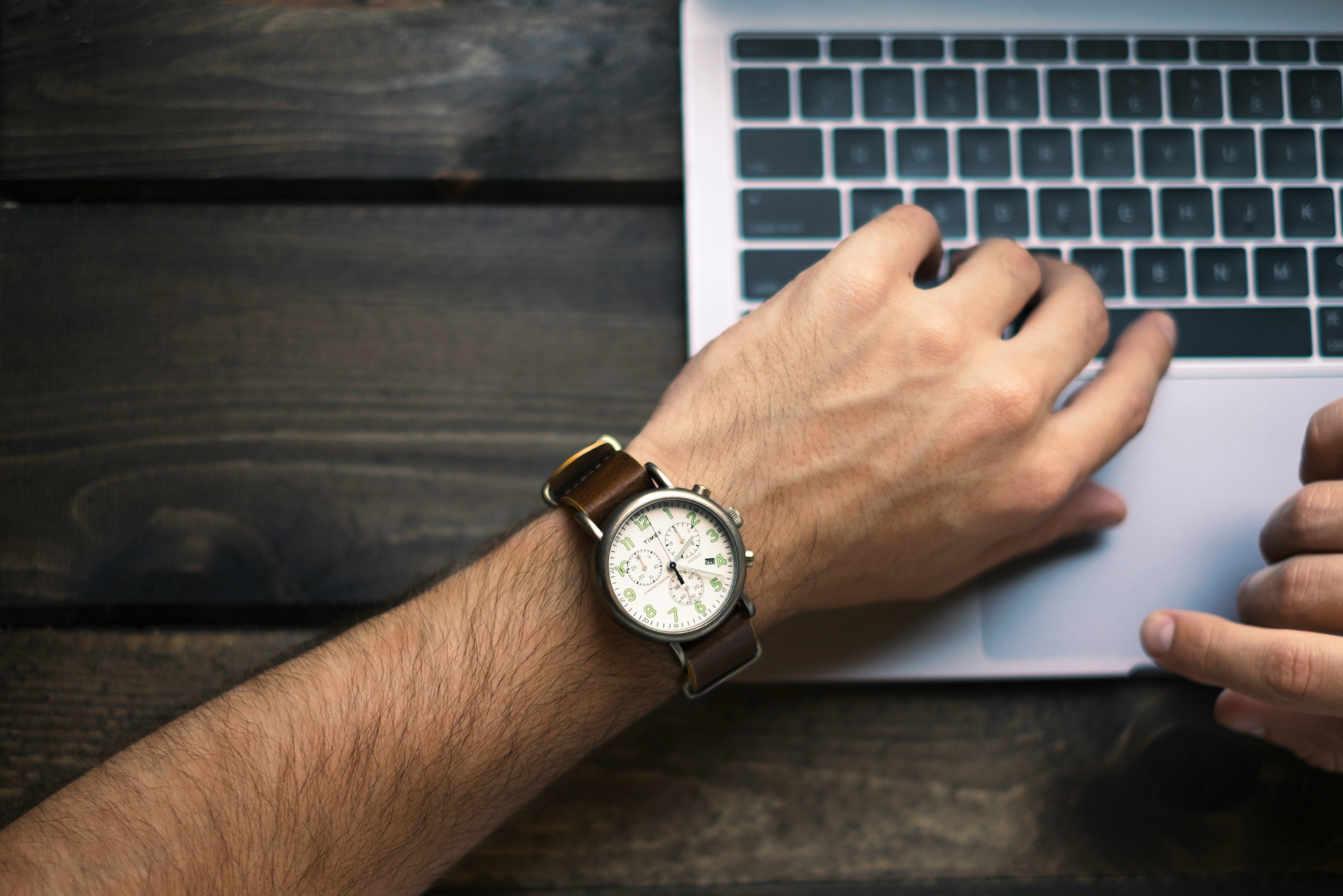 Counting Minutes: Lawyer Logging Time on Laptop